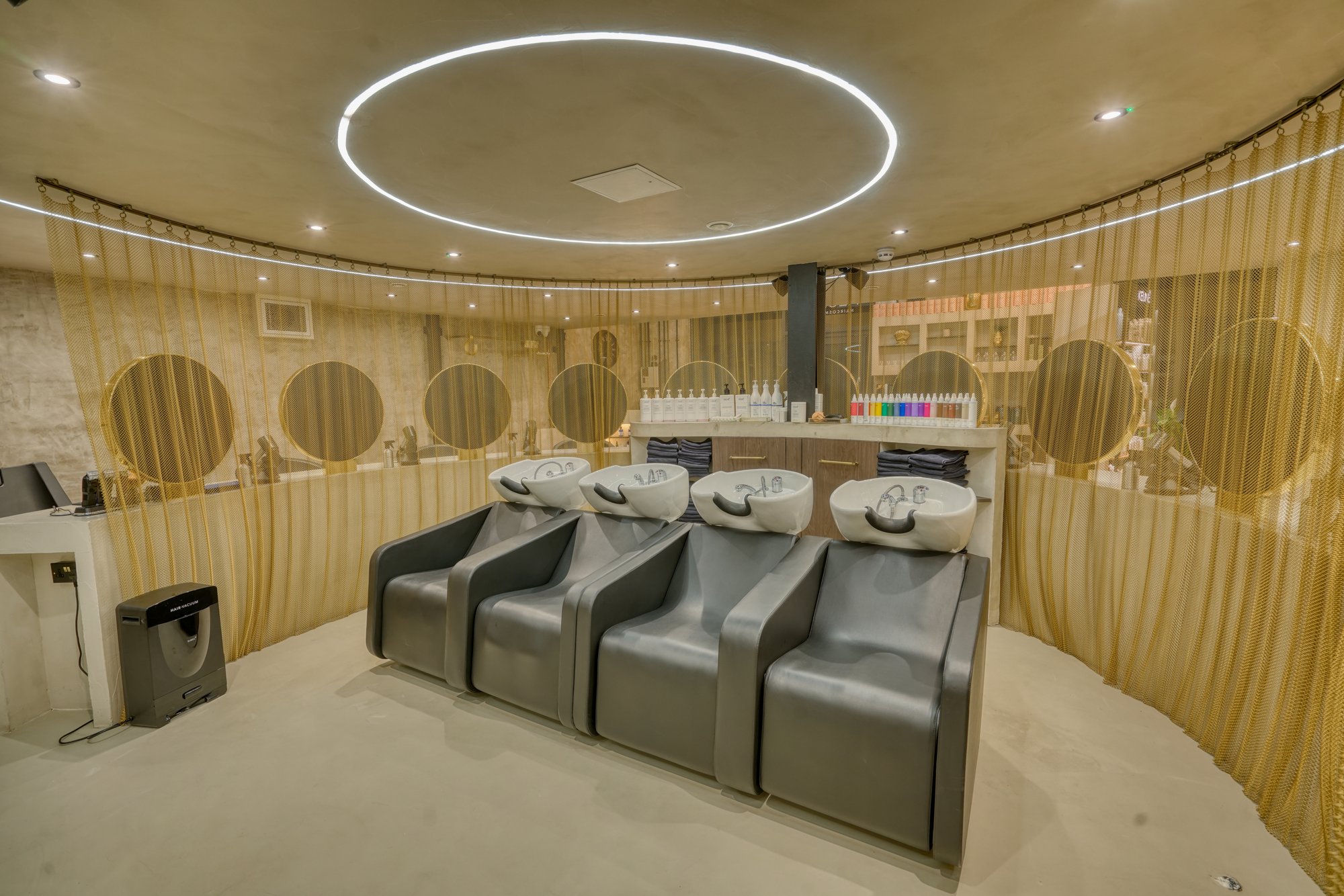 Black wash stations with white basins at Avesta Hair salon, Salford